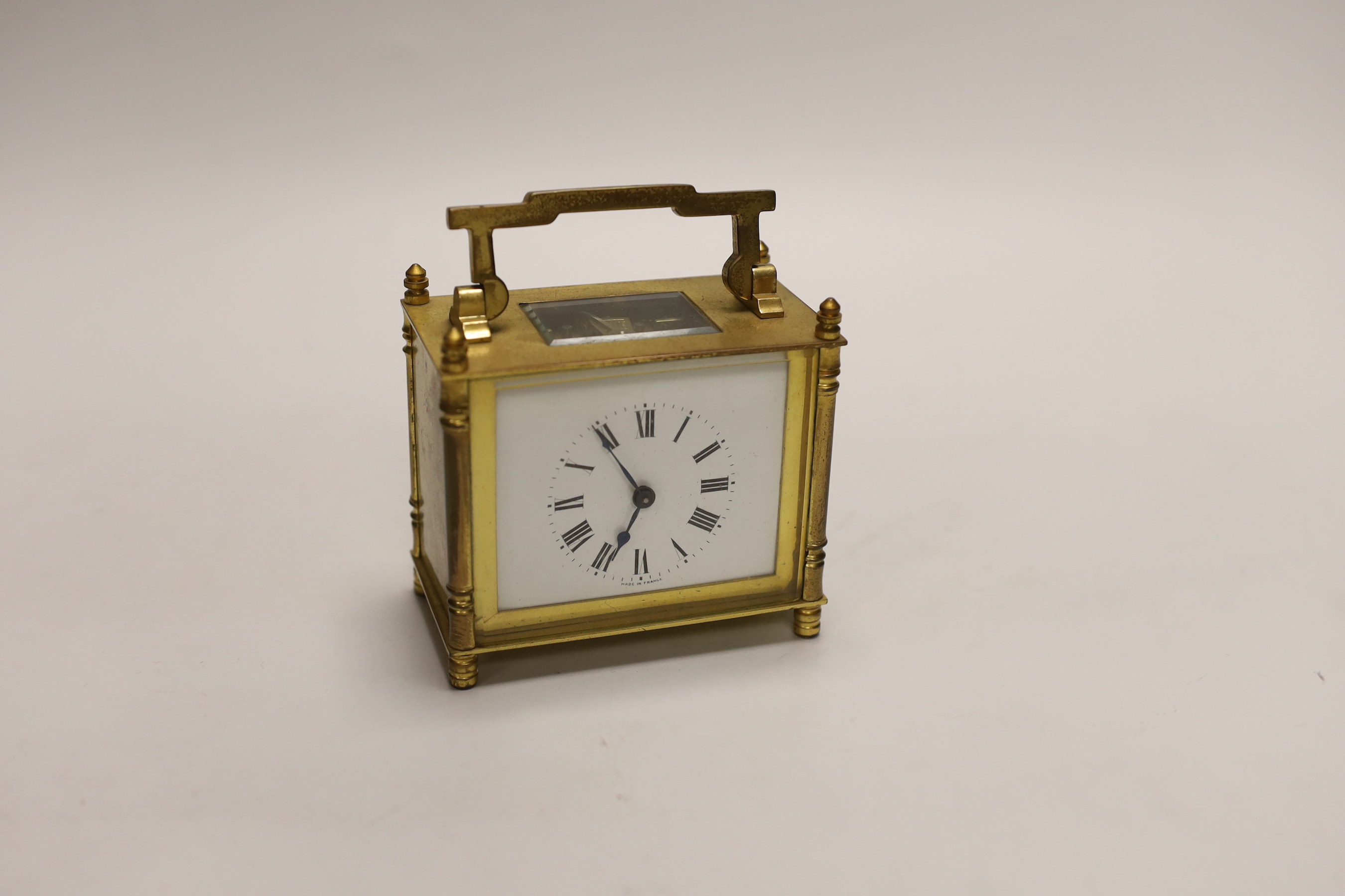 A small French brass carriage clock, 11cm, in leather case